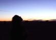 © stockphotoslinds - Silhouette of Person Against Sunset Background