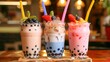 © QAISAR - Three drinks of fruit milk and bubble tea