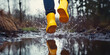 © ArtSav - Splash of water in a puddle, child jumping in a puddle