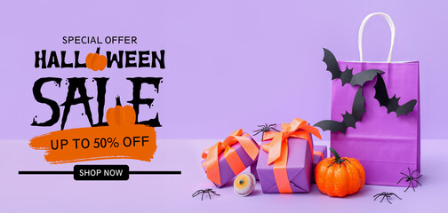 Sticker - Composition with shopping bag, gift boxes, bats and pumpkin for Halloween on purple background