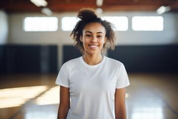 Wall Mural - Portrait of a smiling teenage female African American basketball player