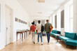 © Hernandez & Sorokina/Stocksy - Three students walking in college corridor