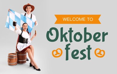 Canvas Print - Young couple in traditional German clothes, with beer and Bavarian flag on grey background. Oktoberfest celebration