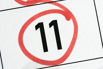 Eleventh number in calendar is circled with red marker.