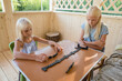 © Evgenij Yulkin/Stocksy - Children play dominoes in a summer terrace