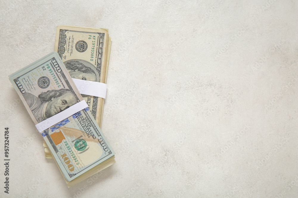 Bundles of dollar banknotes on light background