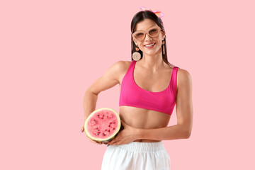 Wall Mural - Young woman with fresh watermelon on pink background