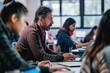© spyrakot - Adult Education Coding Workshop: Engaged Instructor with Students Learning Programming Skills