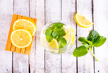 Wall Mural - fresh lemon and mint for cocktail on a table