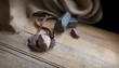 © Marina - An antique leather sling lies on wooden desk