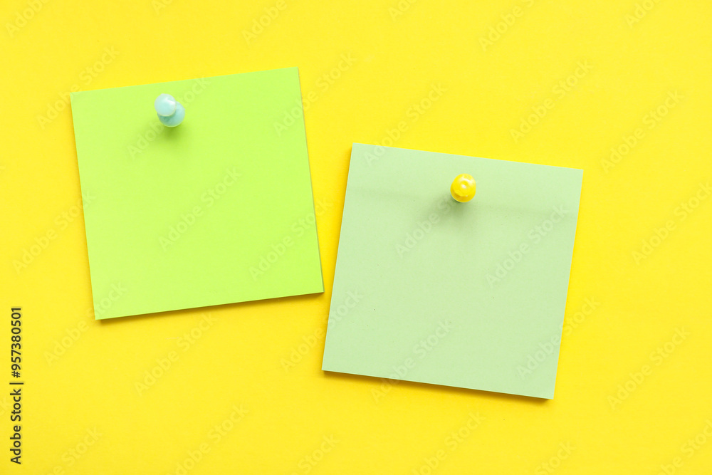 Paper notes pinned on yellow background