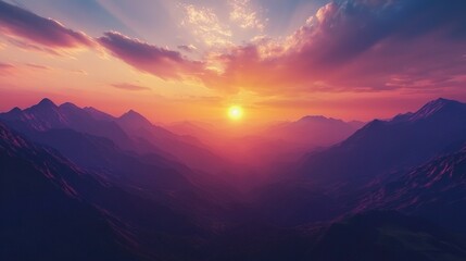 Poster -   Sunset over mountain range with sun in center and clouds in sky