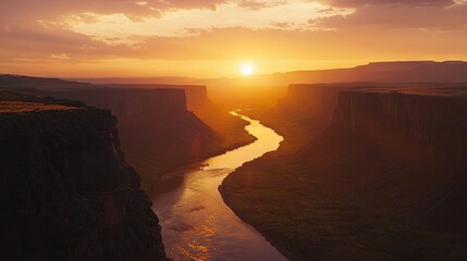 Poster -   Sunset view of a river in the foreground and a mountain in the background over a canyon