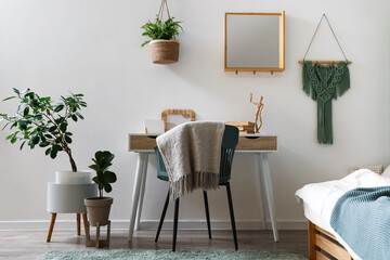 Poster - Comfortable workspace and houseplants in interior of stylish bedroom