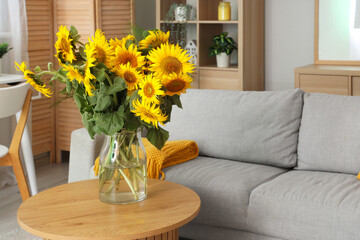 Canvas Print - Stylish living room with grey sofa and vase of sunflowers bouquet on coffee table