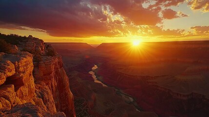 Poster -   The sun descends over a canyon, featuring a river in the foreground and a towering cliff