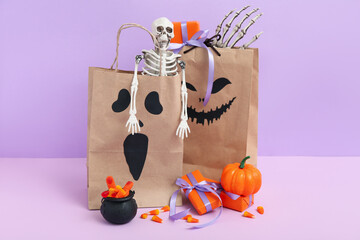 Sticker - Paper shopping bags, gifts, decorations and sweets for Halloween on color background