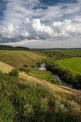 Beautiful high riverbank and clouds