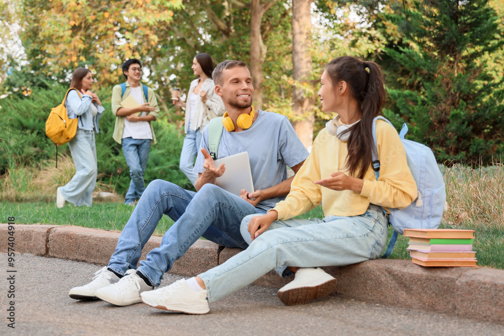 Young students talking in park