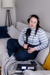 © Oleksii Syrotkin/Stocksy - Woman speaking with eyes closed creating audio content for podcast