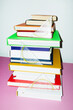 © Colour Laboratory/Stocksy - Colorful books and math set square rulers on office business desk
