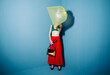 © Ulas&Merve/Stocksy - Woman with Plastic Bag on Head in Colorful Outfit