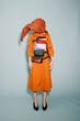 © Ulas&Merve/Stocksy - Surreal Fashion Model with Covered Face and Colorful Bags