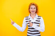 © be free - Professional business woman corporate leader. Woman manager standing isolated on yellow. Caucasian young stylish businesswoman. Redhead woman casual style. Casual fashion. Pointing finger