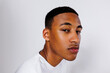 © BONNINSTUDIO/Stocksy - Serious young adult male model posing on white background