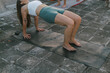 © Marija Mandic/Stocksy - Group rooftop yoga class