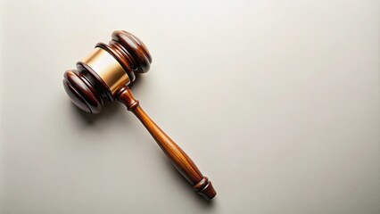 Top view of judge's gavel on a light background, symbolizing law and justice