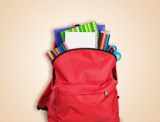 Wall Mural - School backpack containing set of supplies.