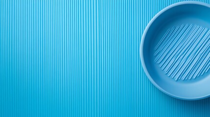 Wall Mural - Blue Plastic Bowl on a Ridged Blue Surface