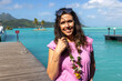 © Mat Hayward - Pretty woman on a tropical island vacation in French Polynesia. The female person is visiting popular tourist destination Bora Bora with beautiful azure turquoise ocean water.