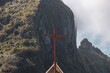 © Mat Hayward - A cross sits on top of a church at the base of Mount Otemanu on the island of Bora Bora. The religious symbol represents faith.