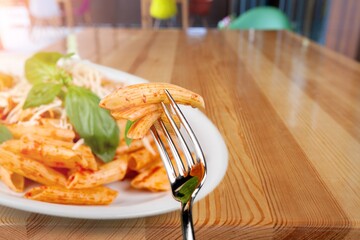 Wall Mural - Tasty fresh macaroni pasta with sauce and basil leaves