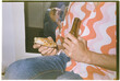 © Juan Moyano/Stocksy - man drinking beer and eating pizza, 35mm film