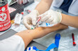 © Chutipon - Close up hand of nurse, taking blood sample from a patient in the hospital.