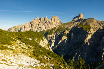 Picturesque rocky landscape overlooking peaks of Torre dei Scarperi mountain in Sexten Dolomites on sunny summer day, South Tyrol, Italy..