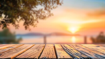 A serene sunset view over water, complemented by a wooden surface, perfect for peaceful and tranquil visual themes.