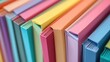 © pinporn manosri - A close-up of multicolored notebooks with their spines visible, highlighting a spectrum of bright and pastel colors. -