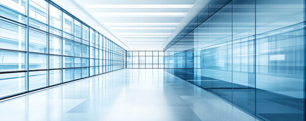 Poster - A large, empty room with a lot of windows. The room is very bright and airy, with a lot of natural light coming in from the windows. The walls are made of glass, which gives the room a modern