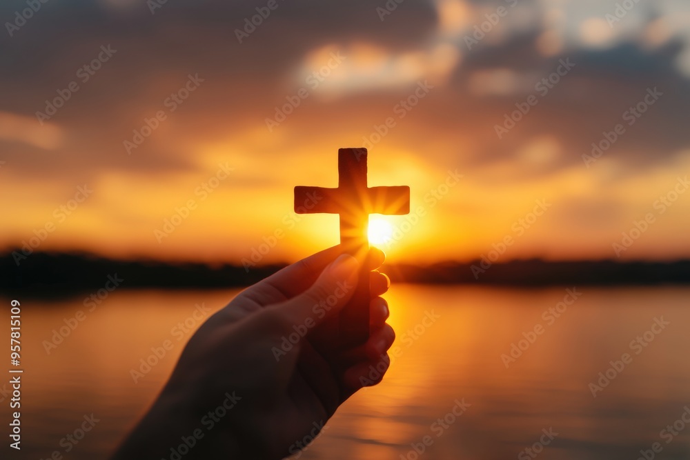Human praying and holding christian cross for worshipping God at sunset ...