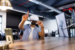 © Wavebreak Media - Using VR headset, Indian man interacting with virtual interface in modern office