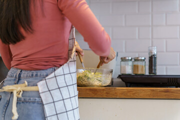 Asian woman preparing vegetable salad in the kitchen Healthy Food Healthy Cooking dieting Weight loss  homemade salad healthy