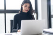 © Charlie's - Beautiful confident asian business woman working with laptop Hands typing  keyboard. Professional investor working new start up project. business planning in office. Technology business