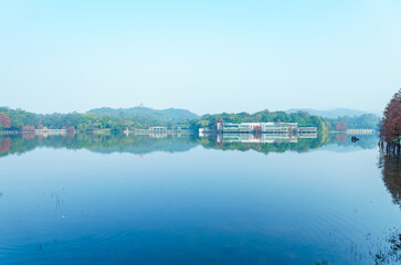 Wall Mural - The green mountains of the park are reflected in the blue waters of the lake