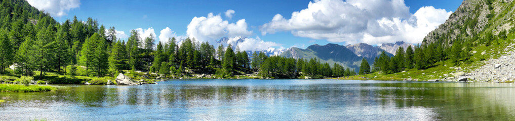 Wall Mural - beautiful scenic panorama in alpine mountain with lake in Aosta valley Italy.