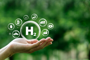 H2, Clean hydrogen energy concept on human hand. Environment. Eco-friendly industry. and alternative energy Future climate friendly energy solutions for net zero goals.