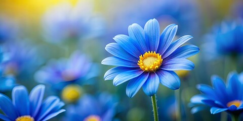 Wall Mural - Vibrant blue flower with yellow center amidst softly blurred field of flowers